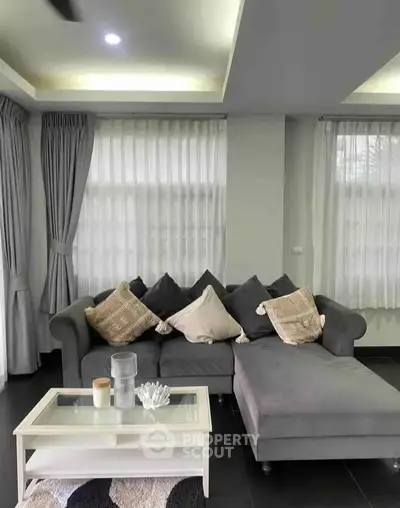 Stylish living room with modern gray sofa and elegant decor