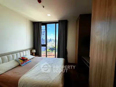 Spacious bedroom with city view in modern apartment