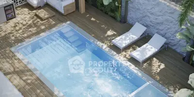 Luxurious outdoor pool area with sun loungers and lush greenery, perfect for relaxation and entertainment.