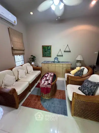 Cozy living room with wicker furniture and elegant decor