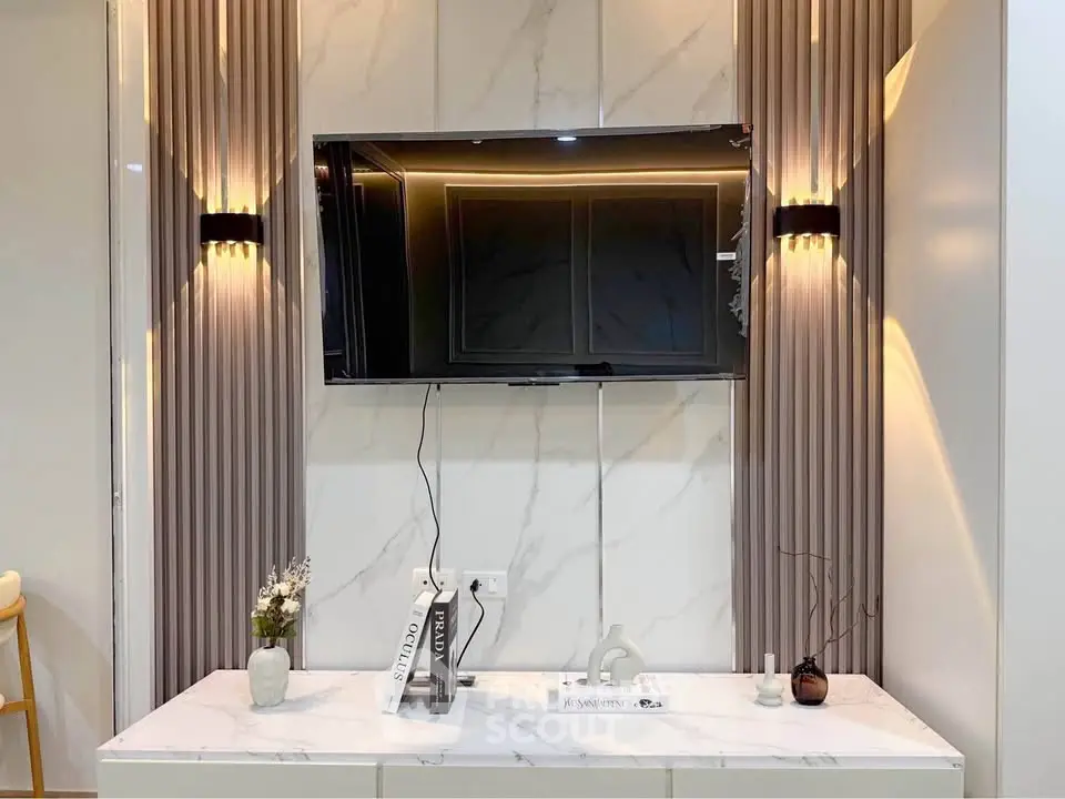 Modern living room with wall-mounted TV and elegant decor