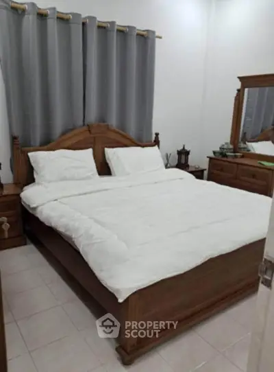 Cozy bedroom with wooden furniture and elegant decor