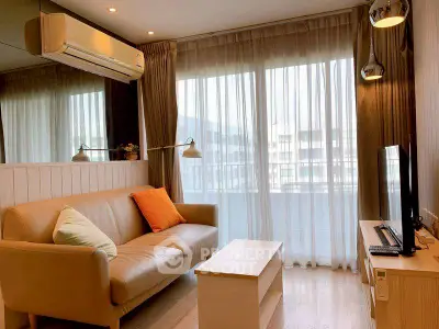 Cozy living room with modern decor and large window view