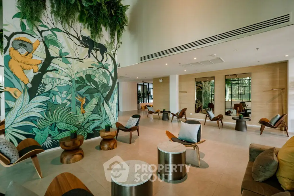Stylish modern living room with unique jungle-themed mural and elegant seating area.