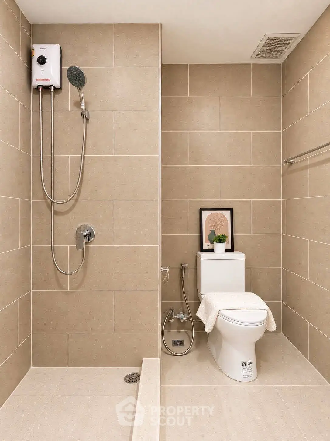 Modern bathroom with sleek shower and toilet in neutral tones