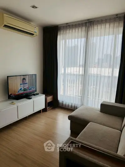 Cozy living room with natural light and modern furnishings