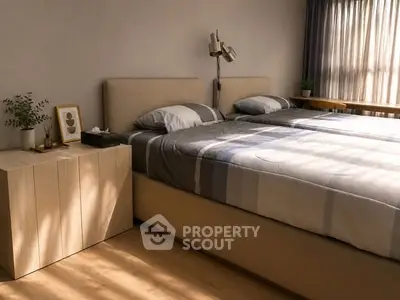Cozy bedroom with stylish decor and natural light, featuring a comfortable bed and modern furnishings.