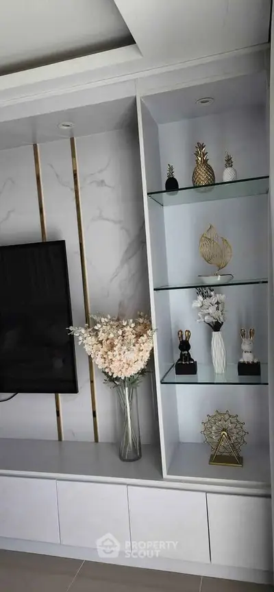 Modern living room with elegant decor and built-in shelving unit