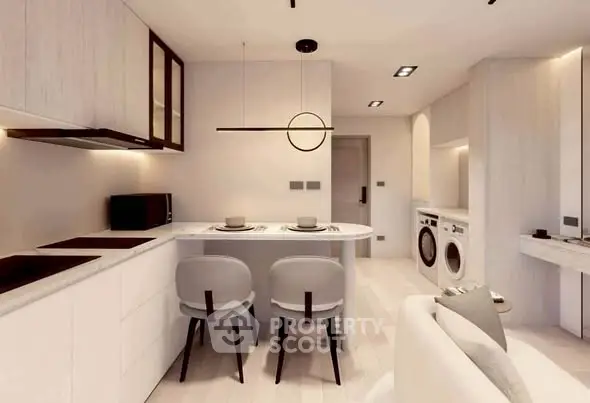 Modern kitchen with sleek design, featuring an island, washing machine, and minimalist decor.