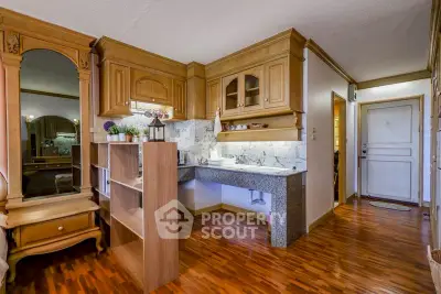 Charming interior with wooden cabinetry and elegant decor in a cozy living space.