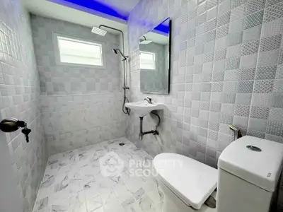 Modern bathroom with sleek fixtures and stylish tile design