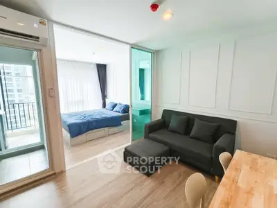 Modern studio apartment with open layout and balcony view