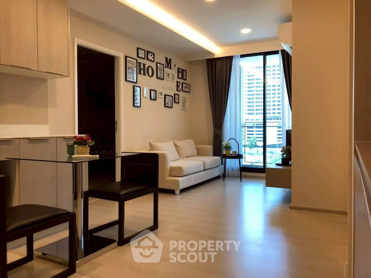 Modern living room with stylish decor and city view from balcony