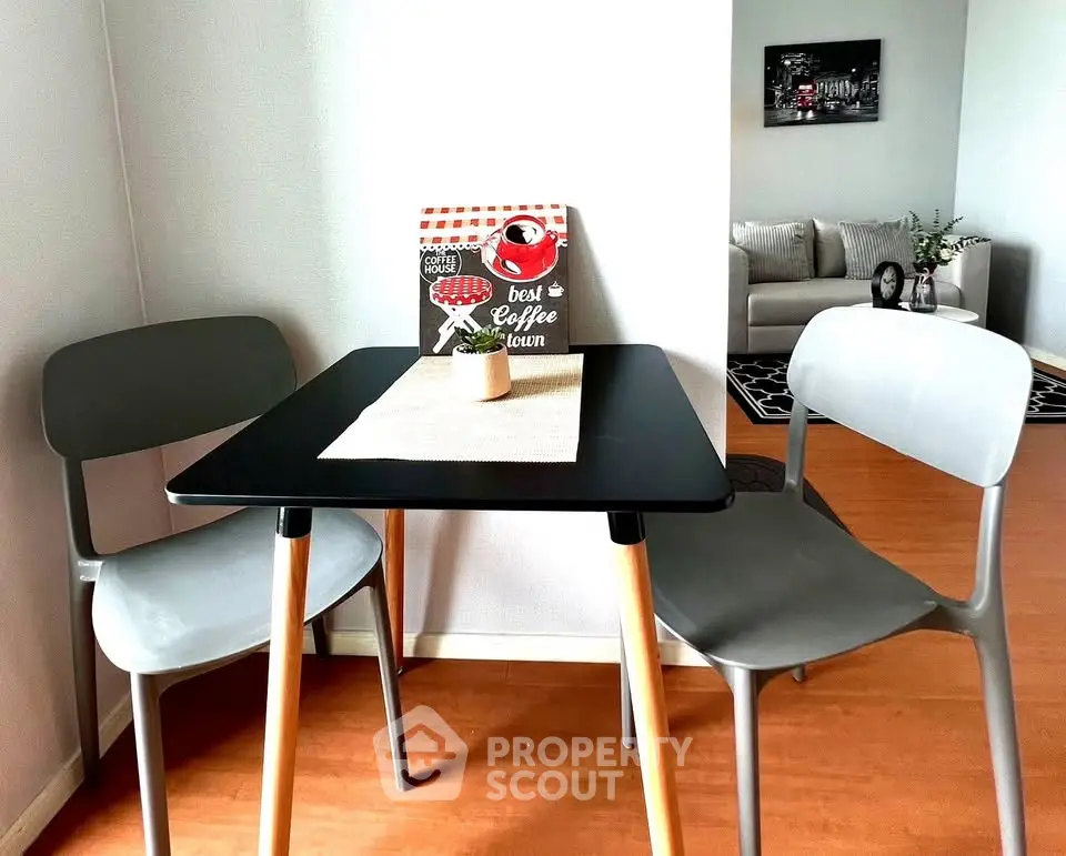 Cozy dining nook with modern chairs and table in stylish apartment