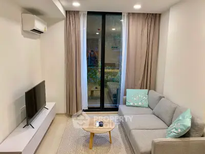 Modern living room with cozy gray sofa and large window view