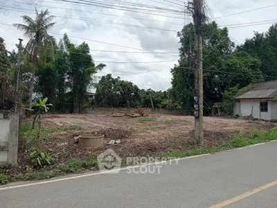 Vacant land plot with lush greenery, ideal for development or investment opportunities.