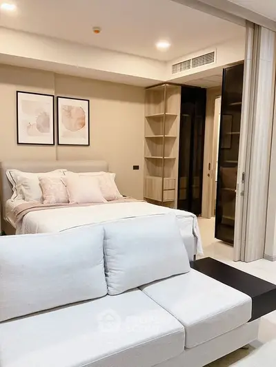 Modern bedroom with stylish decor and cozy seating area