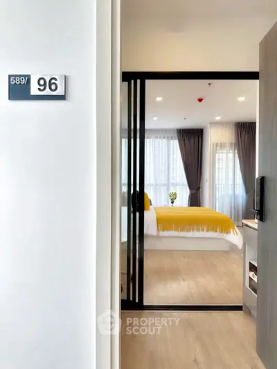 Modern bedroom with sliding glass doors and stylish decor