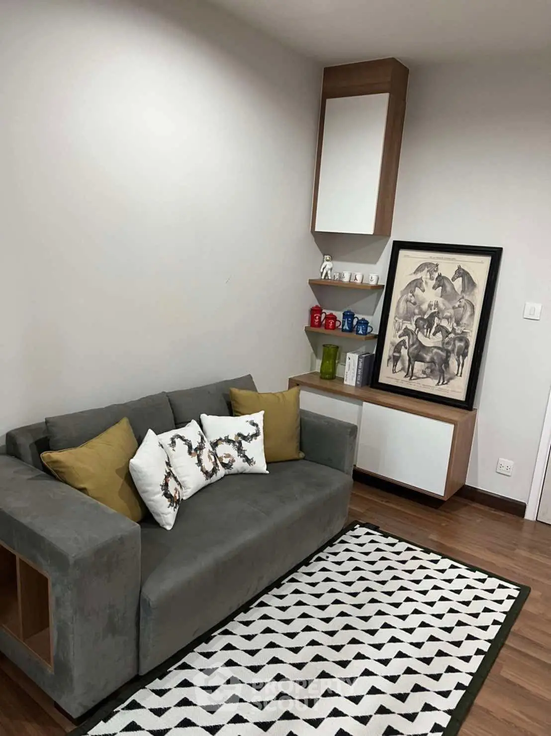Stylish living room with modern sofa and chic decor in a cozy apartment.