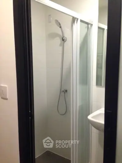 Compact bathroom with modern shower and sleek design