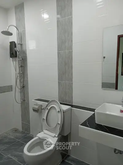 Modern bathroom with sleek tiles and contemporary fixtures