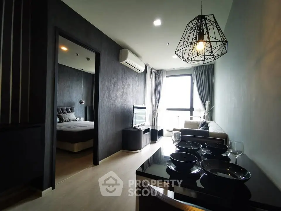 Modern apartment interior with open living room and dining area, featuring stylish decor and natural light.