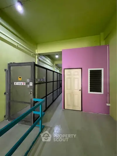 Industrial-style storage unit with vibrant colors and secure metal cage.