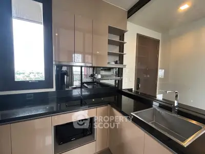 Modern kitchen with sleek cabinetry and built-in appliances