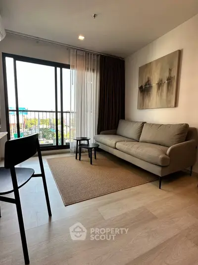 Modern living room with large window and stylish decor