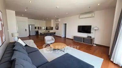 Spacious modern living room with open kitchen and stylish decor