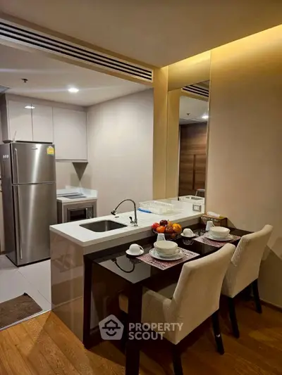 Modern kitchen with open layout and dining area in stylish apartment