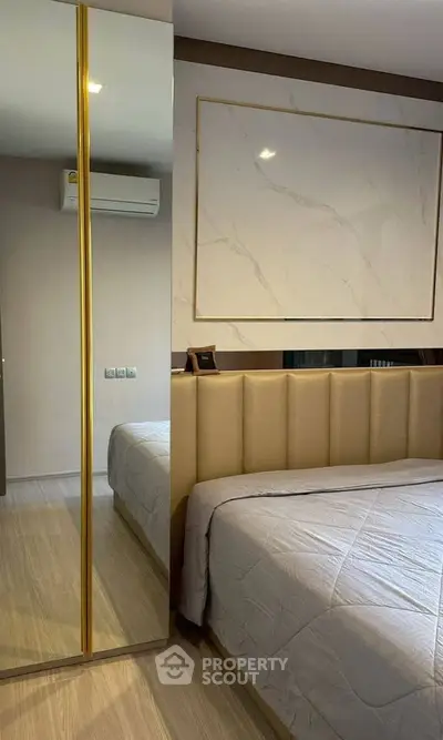 Luxurious bedroom with elegant decor and mirrored closet doors