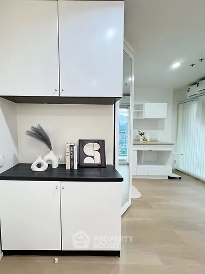 Modern interior with sleek cabinets and stylish decor in a bright living space.