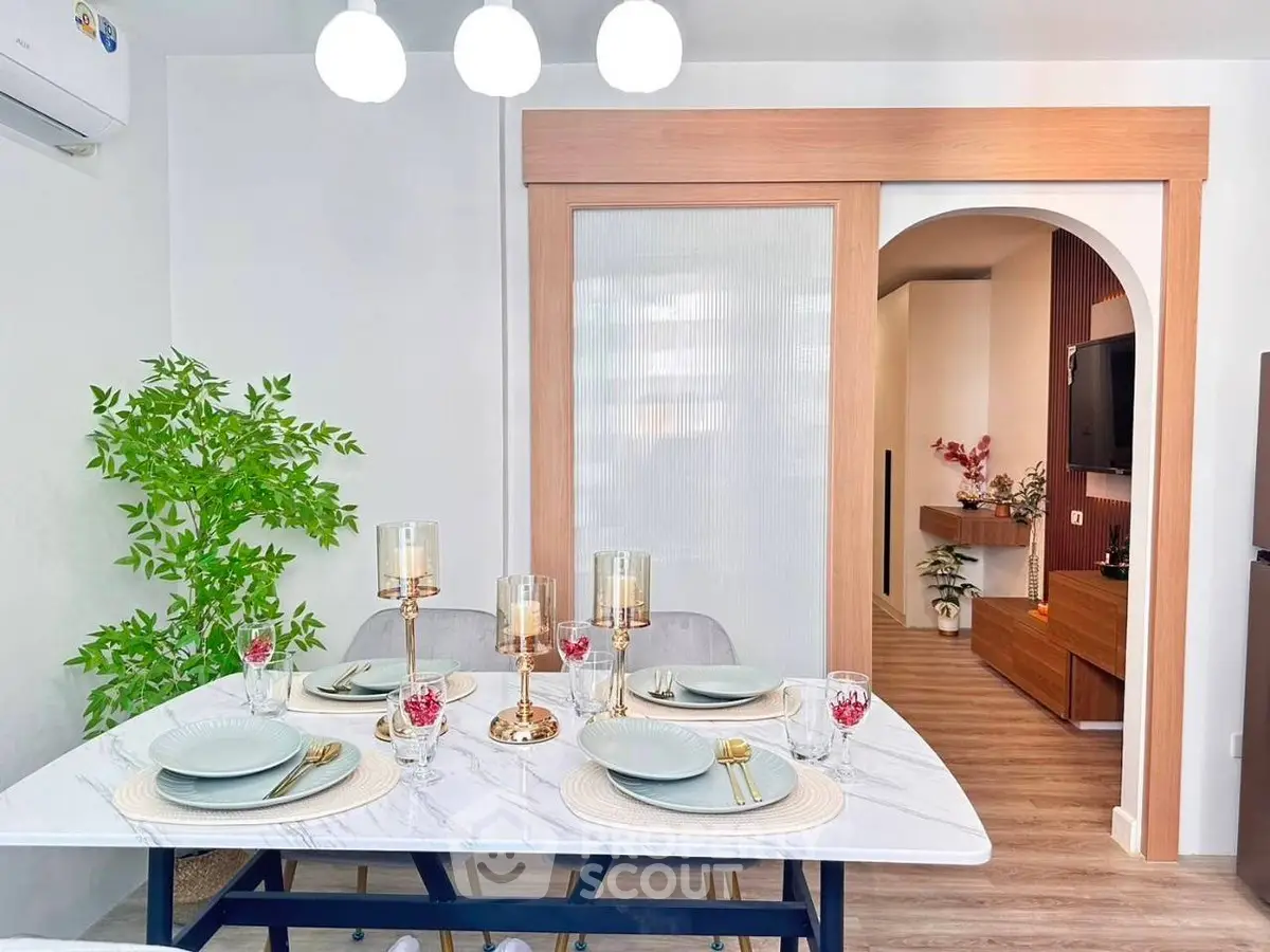 Elegant dining area with modern decor and stylish table setting