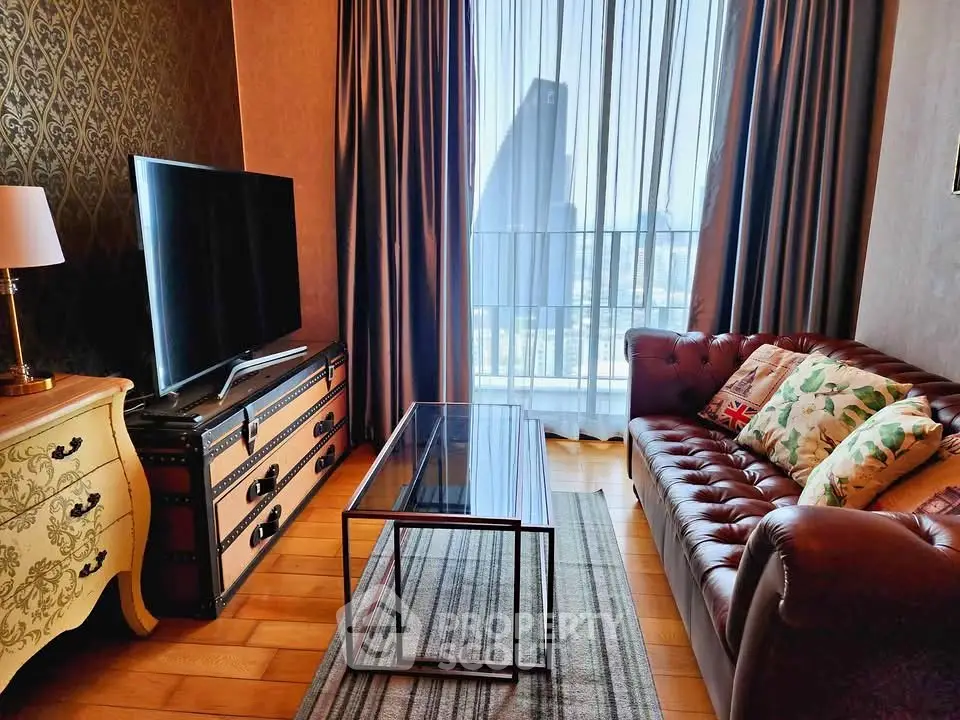 Chic living room with leather sofa, stylish decor, and city view through large windows.