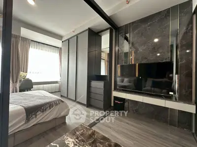Luxurious modern bedroom with sleek design and large windows for natural light.