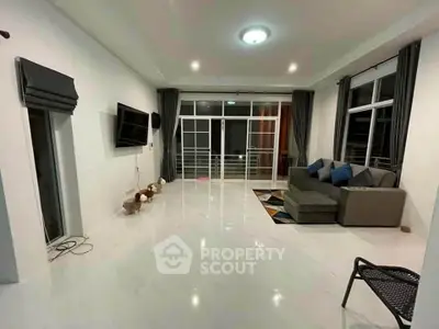 Spacious modern living room with sleek design and large windows