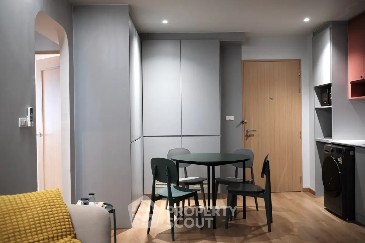 Modern apartment interior with stylish dining area and sleek furniture