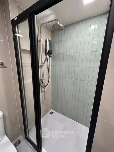 Modern bathroom with sleek shower enclosure and stylish tile design