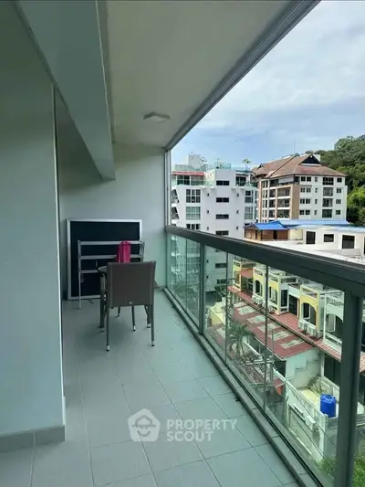 Spacious balcony with city view in modern apartment