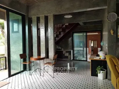 Modern living room with sleek design and large windows for natural light