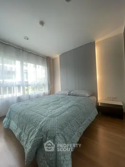 Modern bedroom with large windows and stylish decor