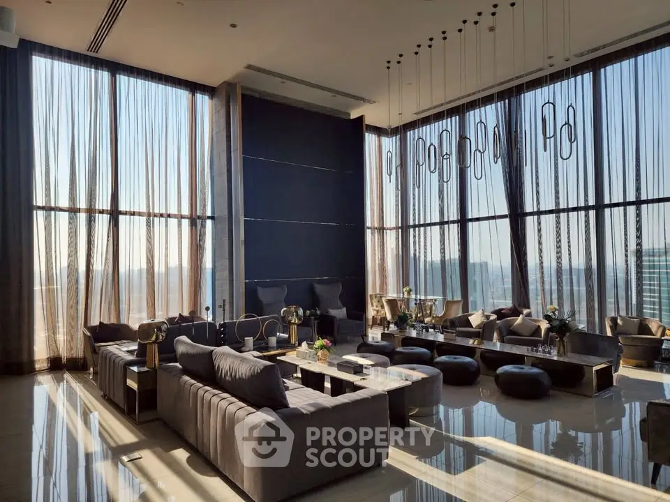 Luxurious modern living room with floor-to-ceiling windows and elegant decor