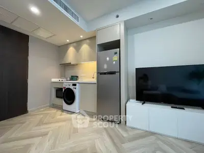 Modern apartment interior with sleek kitchen and cozy living area