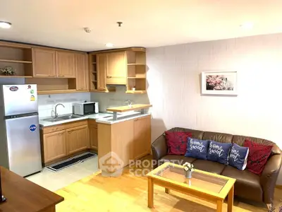 Charming open-layout kitchen and living room with cozy decor and modern appliances.