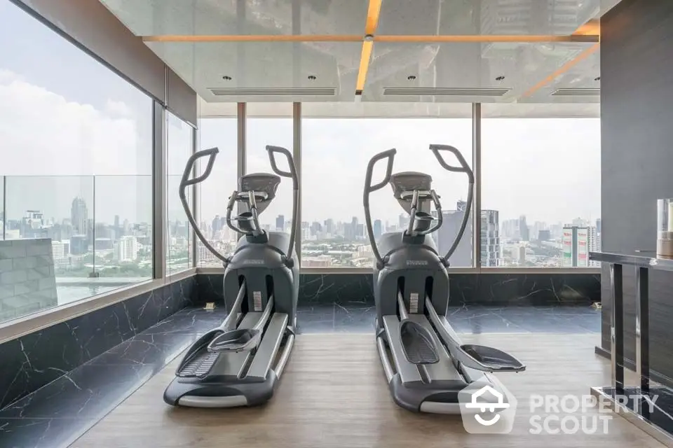 Luxury gym with city view and modern exercise equipment