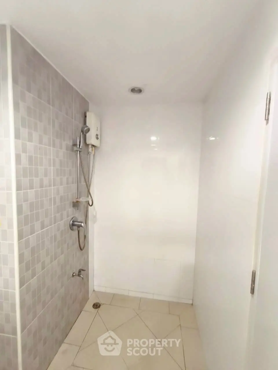 Modern bathroom with sleek shower design and neutral tiles