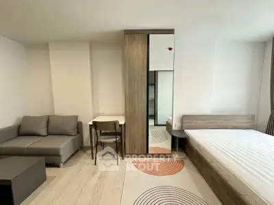 Modern bedroom with stylish furniture and cozy decor in a contemporary apartment.