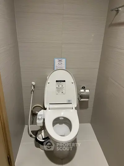 Modern bathroom with high-tech toilet and sleek design