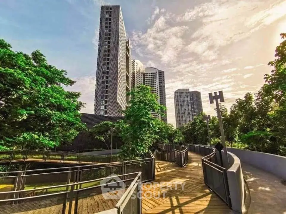 Stunning modern high-rise building with lush greenery and scenic walkway